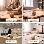 Collage of a decorative sphere in different settings: meditation space, office desk, cash counter, and study table.