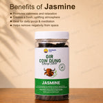 A jar of Dhwani Astro 'Gir Cow Dung' labeled 'Jasmine' sits on a wooden surface against a beige background with text detailing its benefits. 