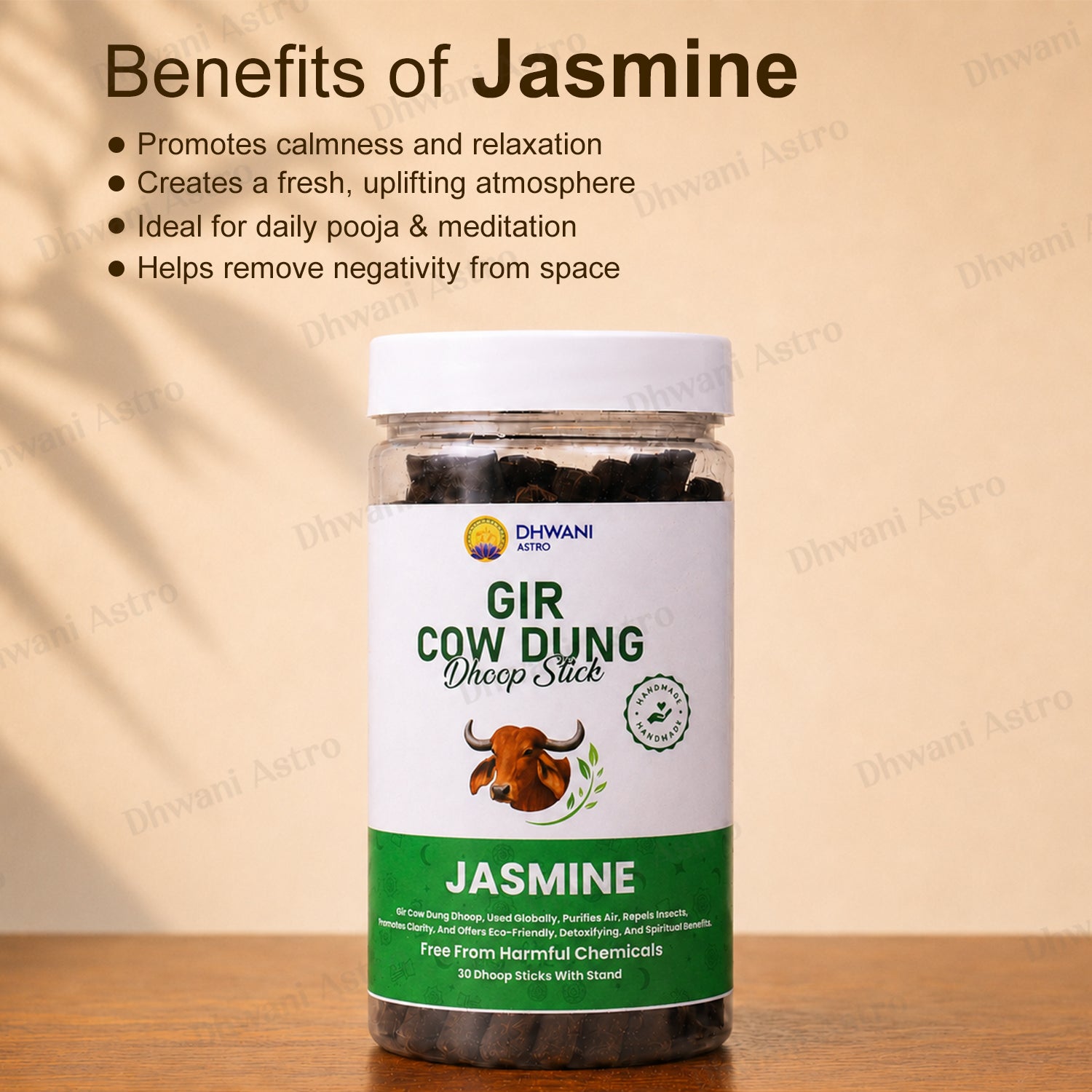 A jar of Dhwani Astro 'Gir Cow Dung' labeled 'Jasmine' sits on a wooden surface against a beige background with text detailing its benefits. Gir Cow Dung Dhoop Sticks | Pure Gau Dung Incense for Pooja, Meditation & Positive Energy | BUY 2 GET 1 FREE