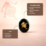 Tourmaline crystal with Leo zodiac symbol on a pink background