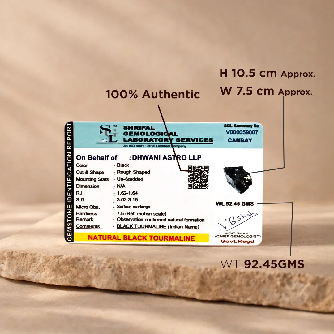 Gemstone identification report with Shriraf Gemological Laboratory Services on a wooden surfaceRough Natural Black Tourmaline Stone – Certified Raw Protection