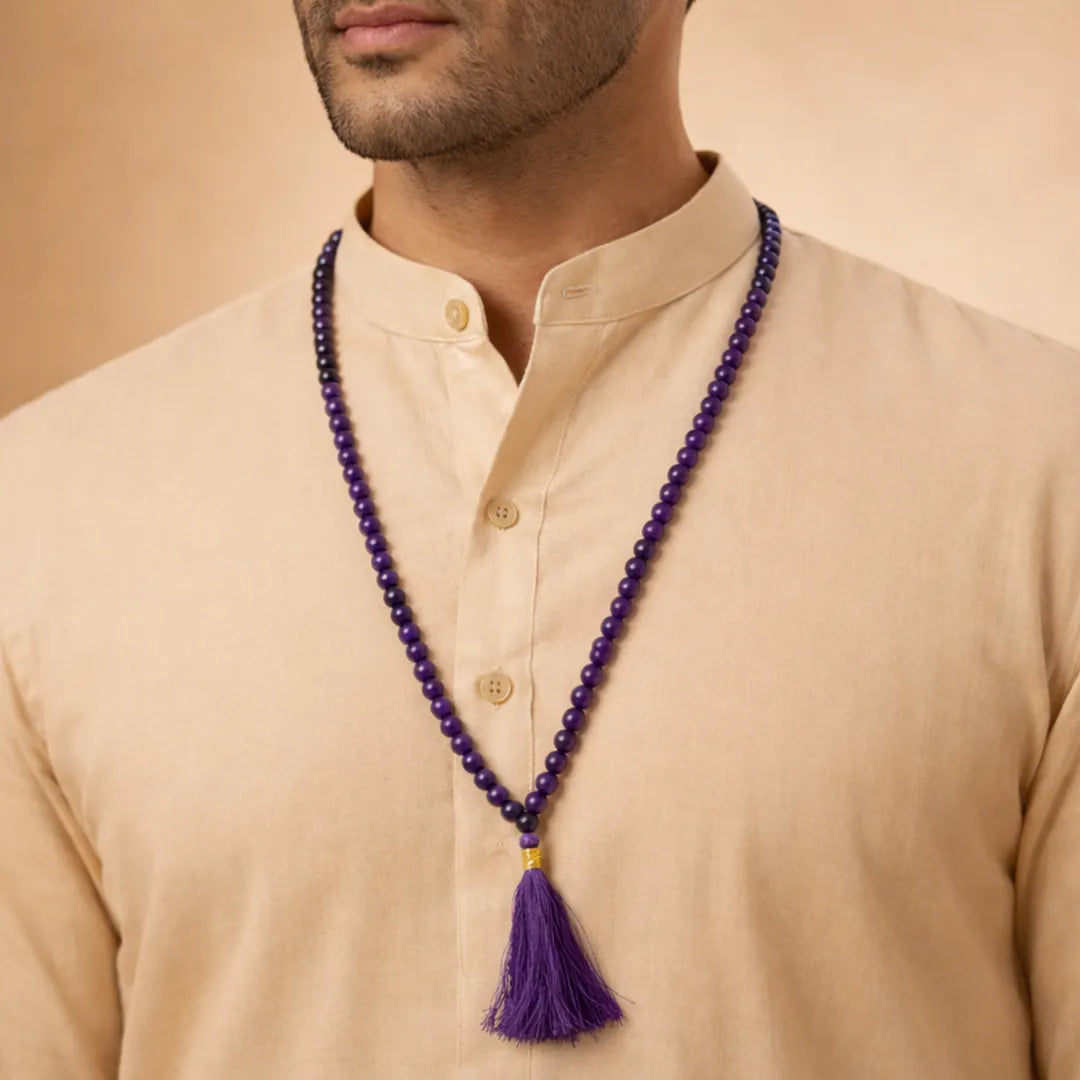 Man wearing a beige kurta with a purple beaded necklace and tassel.Amethyst Crystal Mala – Peace, Focus & Spiritual Healing