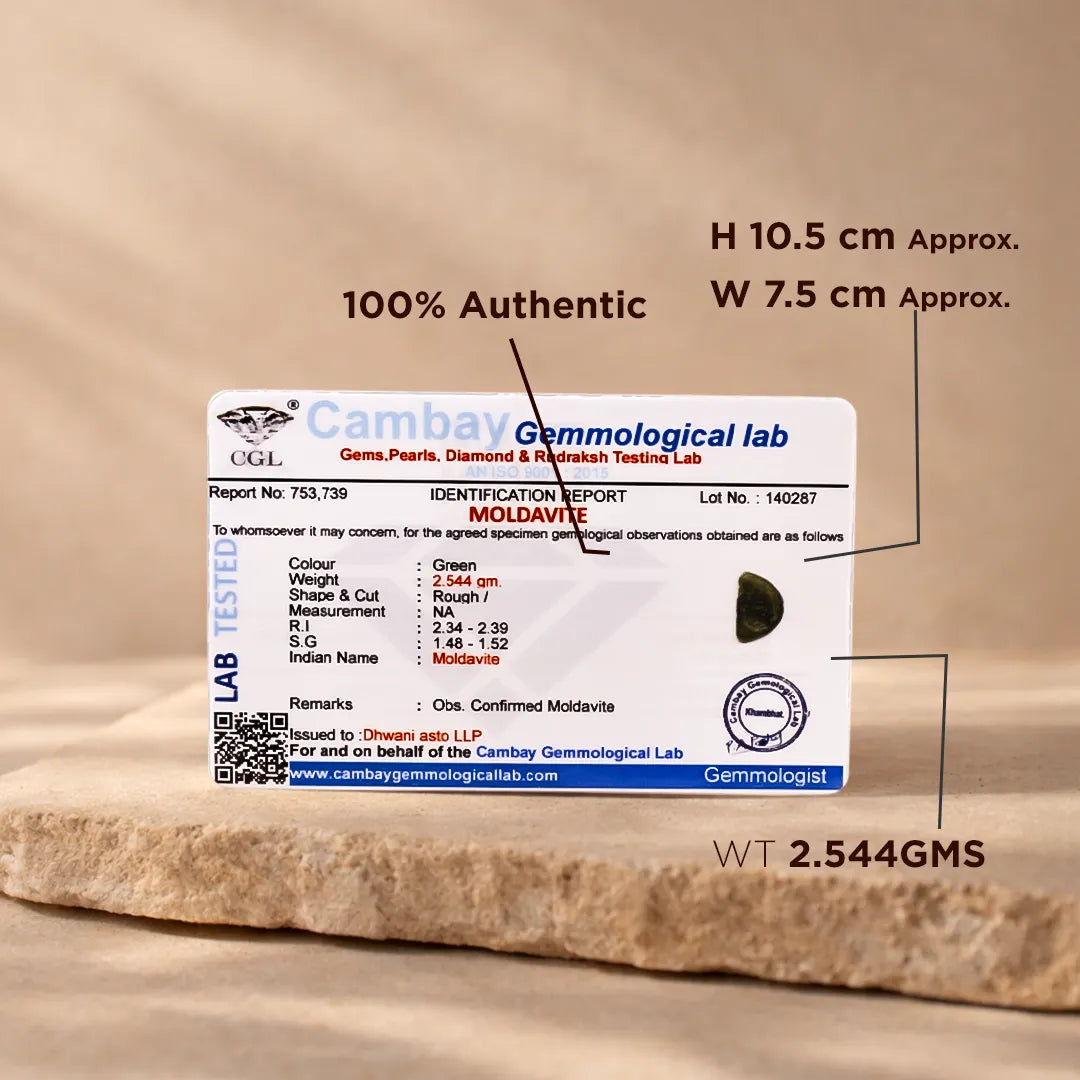 Identification report for a Moldavite with Cambay Gemmological Lab details on a wooden surface.