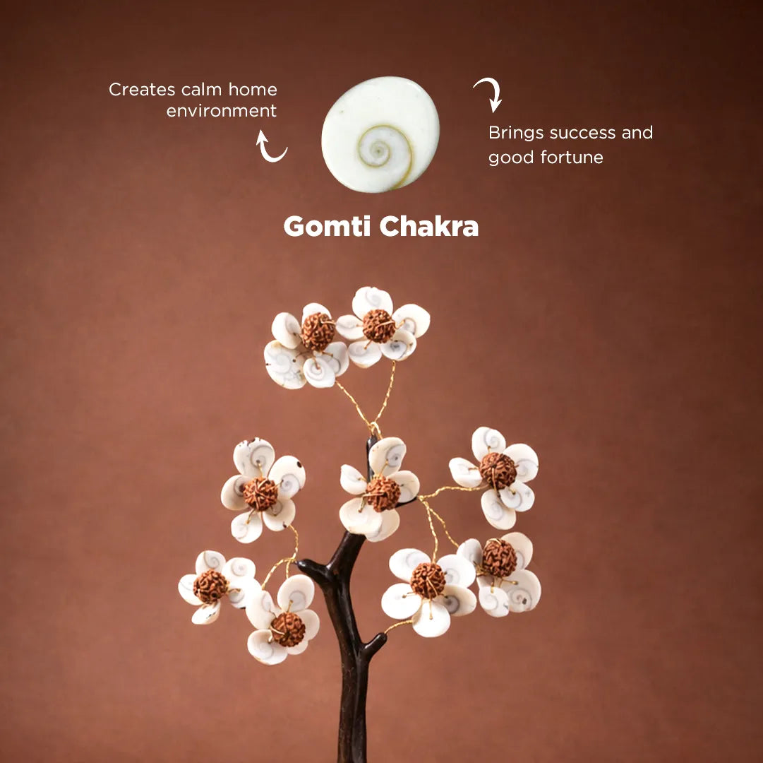 Gomti Chakra with decorative flowers on a brown background