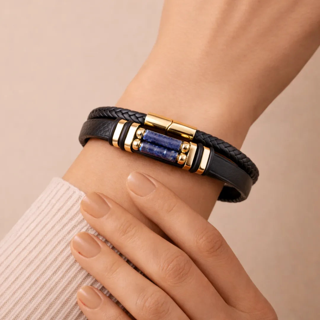 Black leather bracelet with gold and blue accents on a wrist against a beige backgroundLapis Lazuli Leather Bracelet – Wisdom, Truth & Inner Power Wear