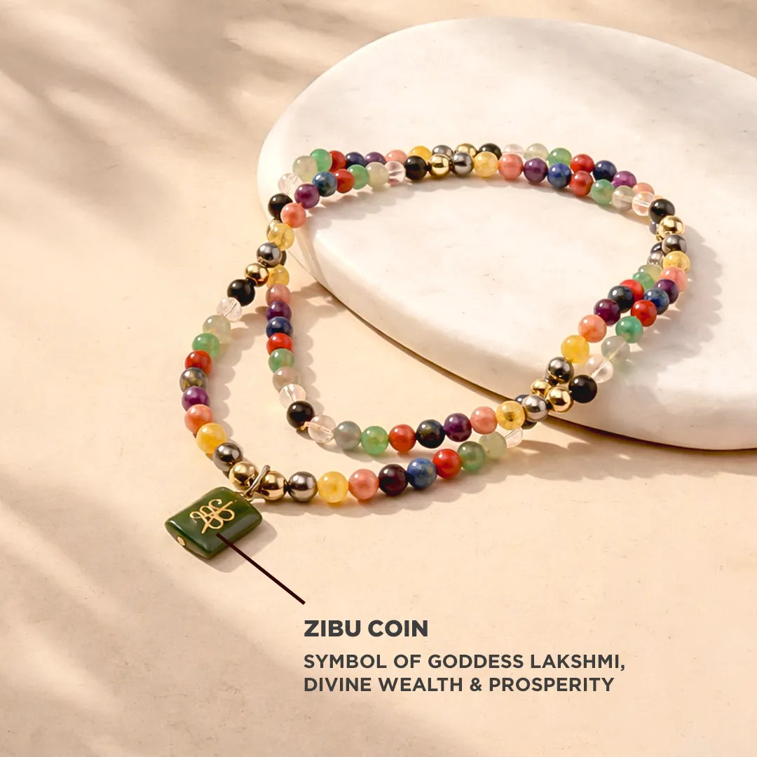 Colorful beaded bracelet with a green coin charm on a beige background, featuring the brand 'ZIBU COIN'.