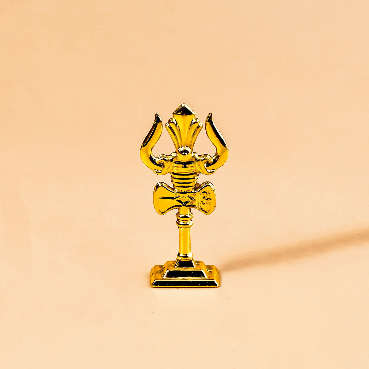 Gold trophy on a beige background