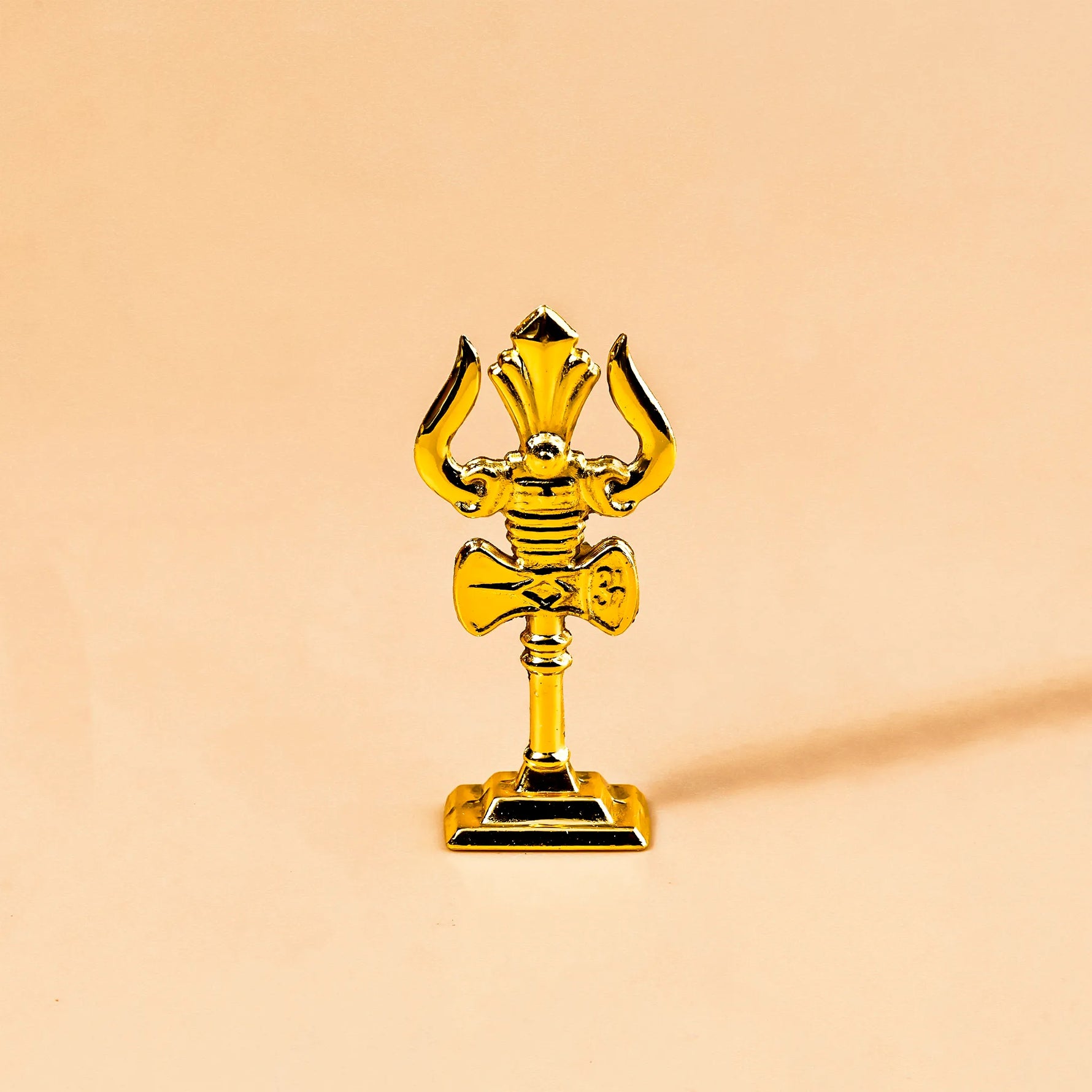 Gold trophy on a beige backgroundMurugan Trishul Vel – Abhimantrit & Certified