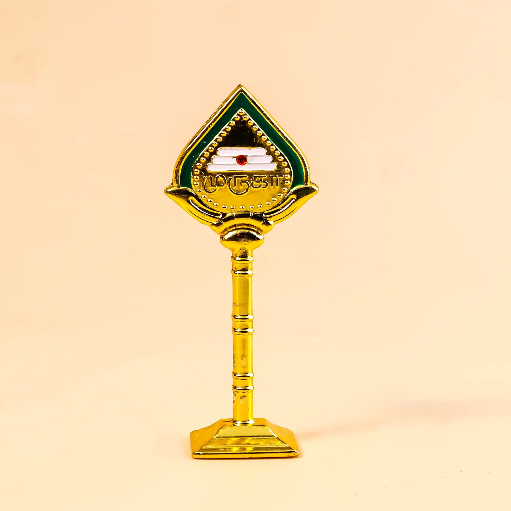 Decorative object with a green and gold design on a beige backgroundMurugan Vel – Divine Protection & Victory Symbol | Abhimantrit & Certified