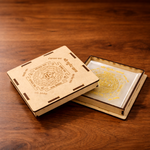 Wooden box with intricate carvings on a wooden surface