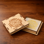 Wooden box with engraved designs on a wooden surface