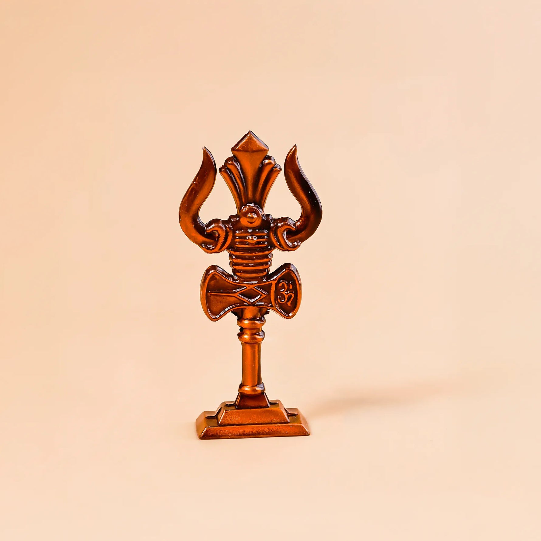 Decorative object resembling a trident on a beige backgroundMurugan Trishul Vel – Abhimantrit & Certified