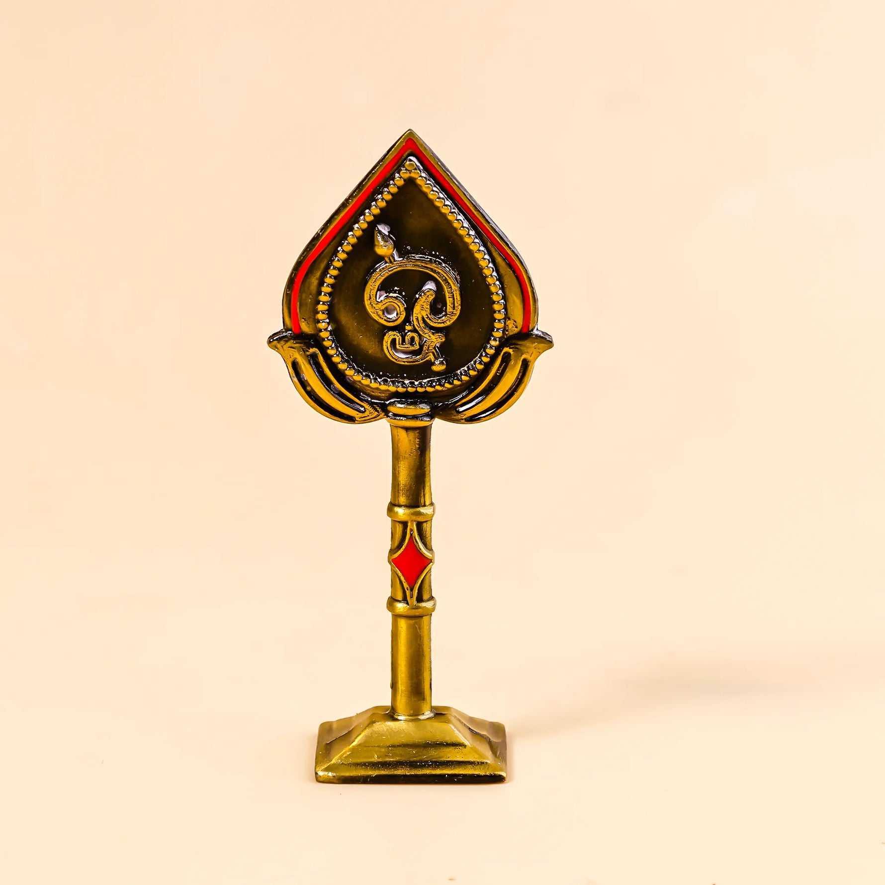 Decorative object with a central emblem on a beige backgroundMurugan Face Mina – Divine Blessings & Protection | Abhimantrit & Certified