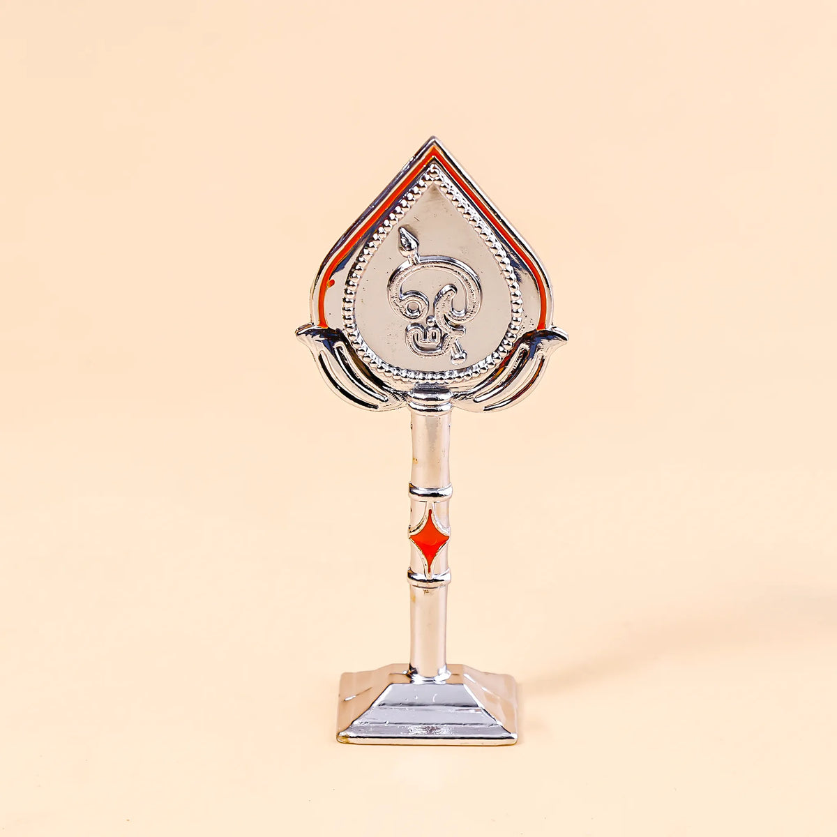 Decorative object resembling a card suit symbol on a beige background