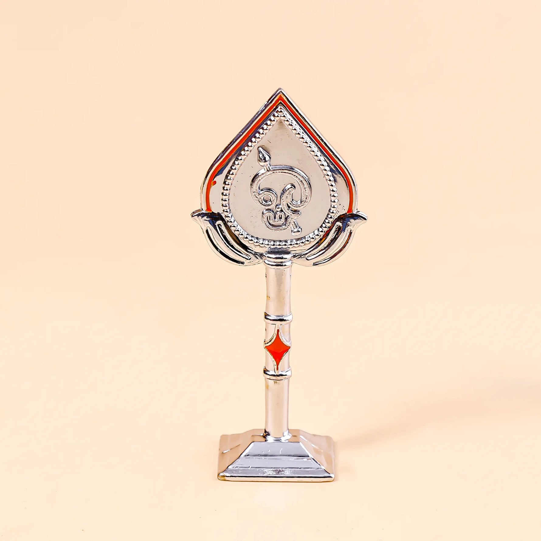 Decorative object resembling a card suit symbol on a beige backgroundMurugan Face Mina – Divine Blessings & Protection | Abhimantrit & Certified