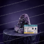 Amethyst crystal on a dark pedestal with a certificate of authenticity in front, against a branded background.