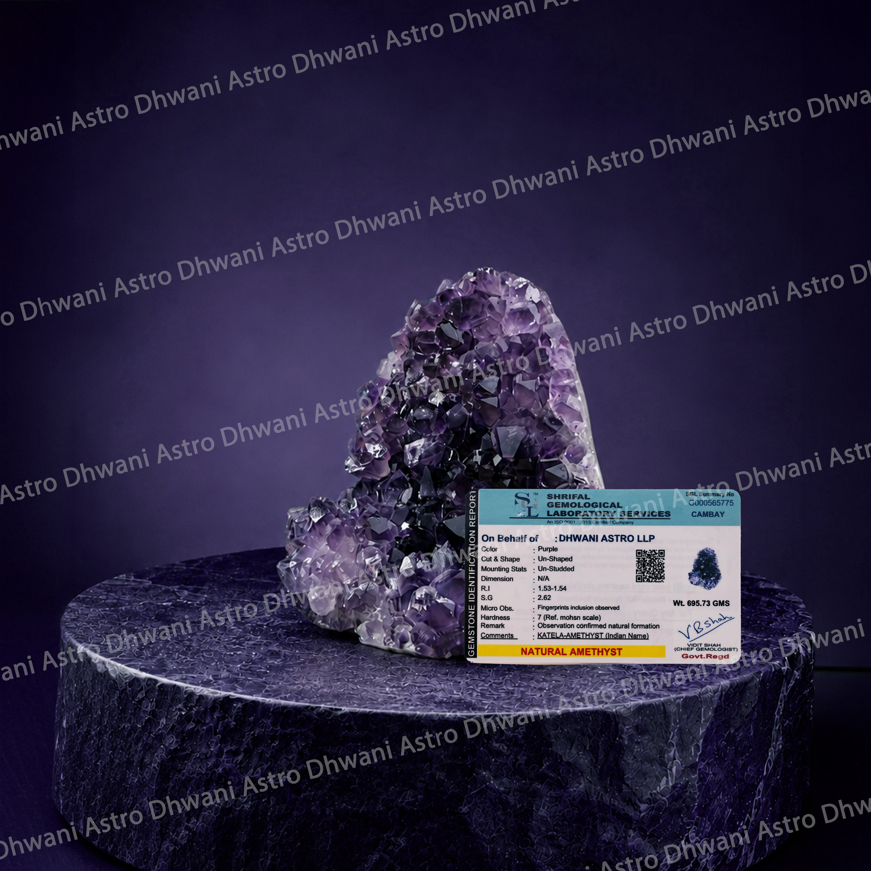 Amethyst crystal on a dark pedestal with a certificate of authenticity in front, against a branded background.Amethyst Cluster for Peace, Positivity & Spiritual Décor