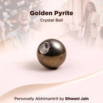 Crystal ball labeled 'Golden Pyrite' with people in the background