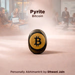 Pyrite Bitcoin on a desk with people working in the background