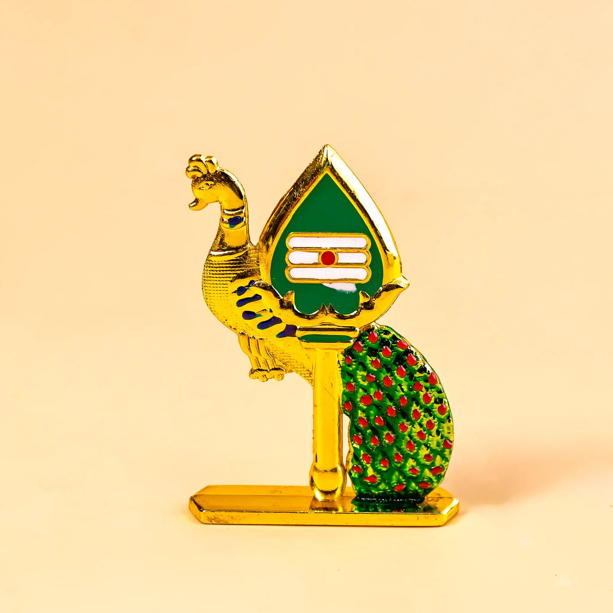 Decorative figurine with gold, green, and red colors on a beige background