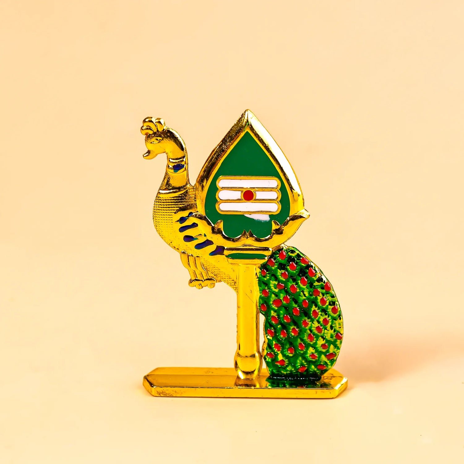 Decorative figurine with gold, green, and red colors on a beige background