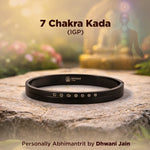 Black chakra ring on a stone surface with blurred garden background