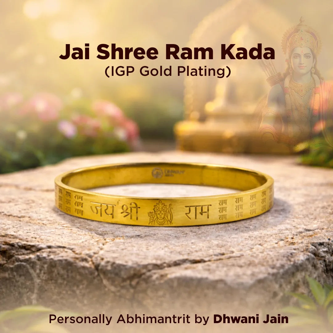 Gold bracelet with 'Jai Shree Ram Kada' text on a stone surface with a blurred background