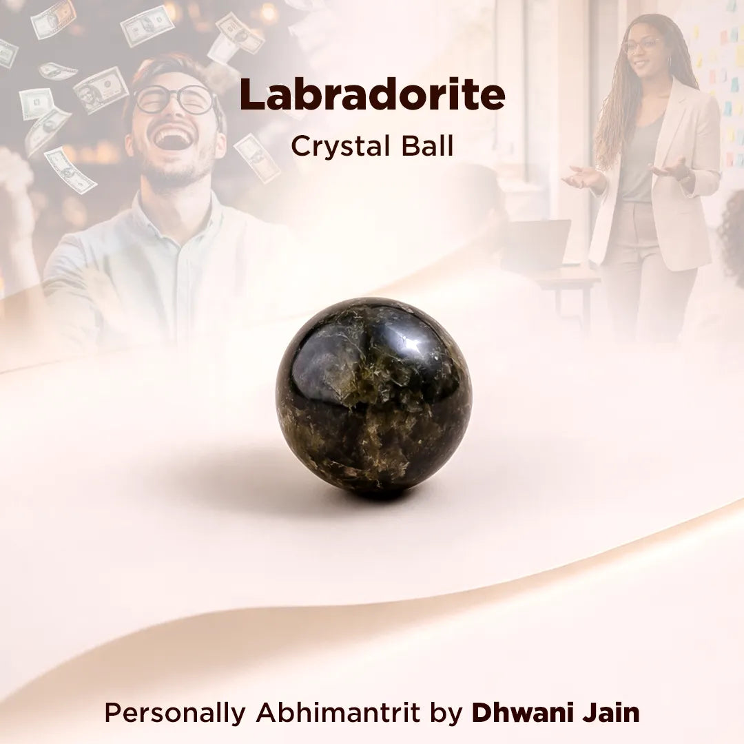 Labradorite crystal ball with blurred people in the background