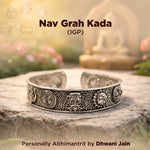 Decorative silver bracelet on a stone surface with blurred background