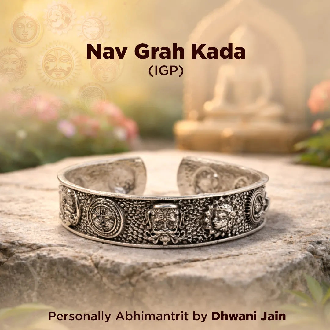 Decorative silver bracelet on a stone surface with blurred background