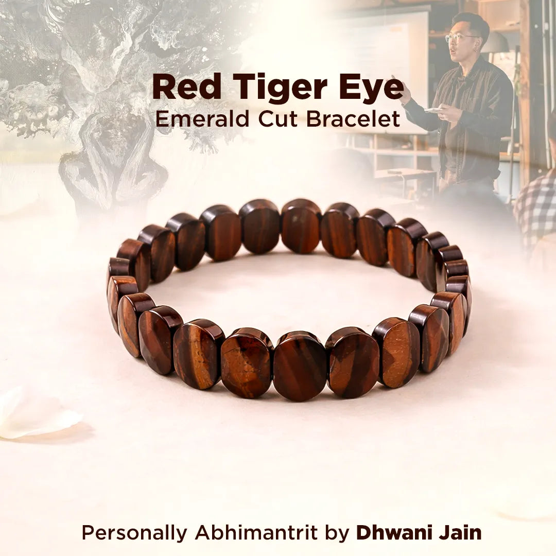 Red Tiger Eye Emerald Cut Bracelet with a blurred background of a person and sculpture.