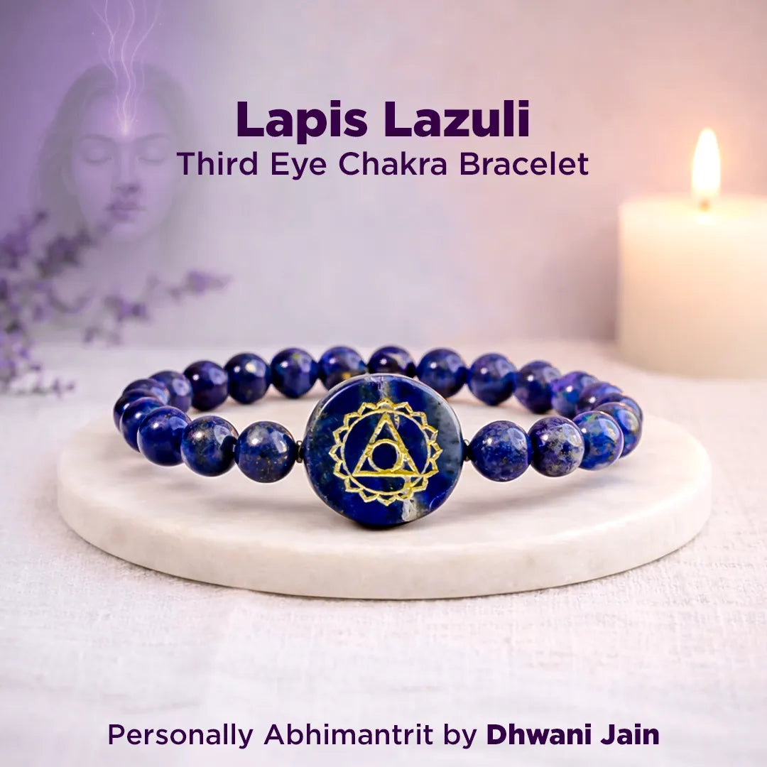 Lapis Lazuli Third Eye Chakra bracelet on a white surface with a candle in the background