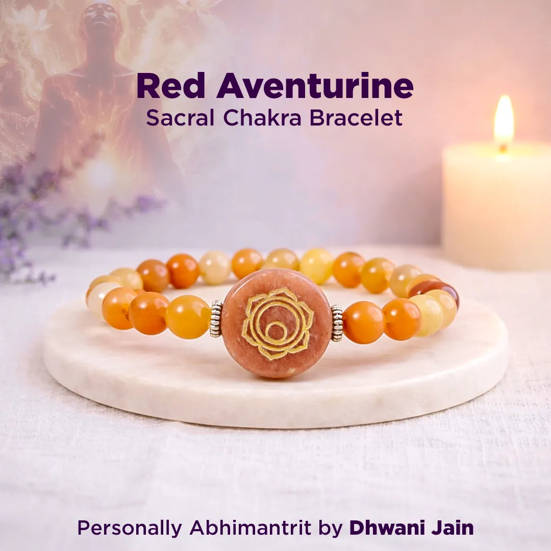 Red Aventurine Sacral Chakra Bracelet on a wooden stand with a blurred background