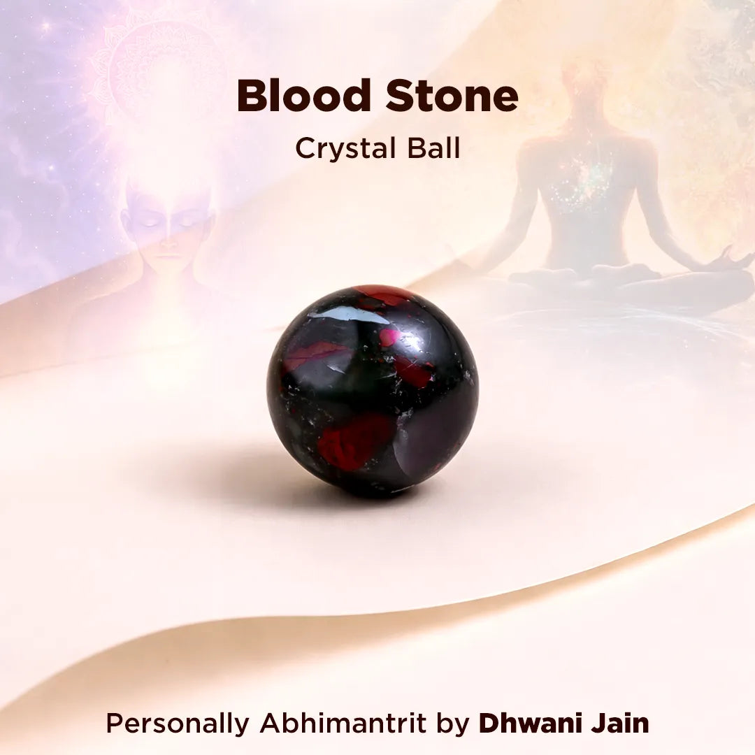 Blood stone crystal ball with a blurred figure in the background