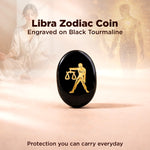 Black tourmaline coin with Libra zodiac symbol on a soft pink background