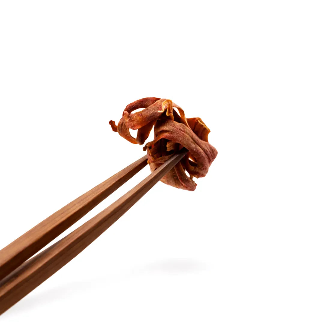 Wooden chopsticks holding a piece of dried shrimp on a white backgroundJavitri Mace – Remedy for diabetes , Indigestion & oral problems