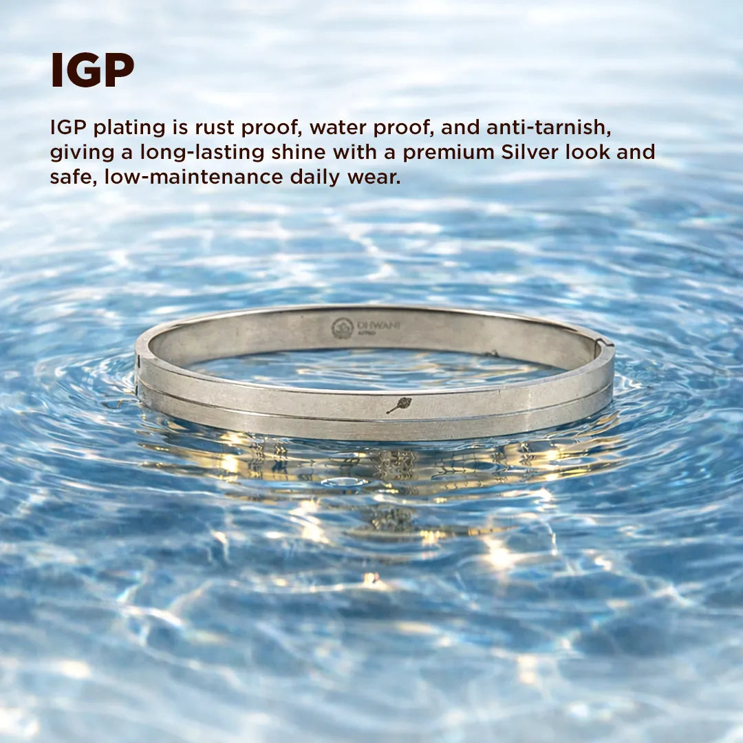 Silver ring with IGP plating floating on water
