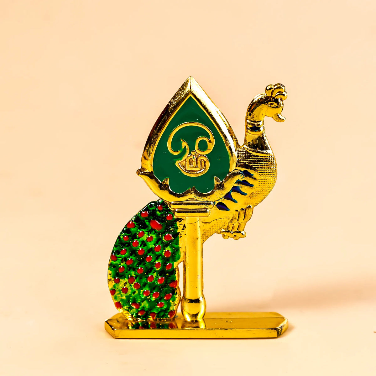 Decorative peacock figurine with green and red details on a beige background