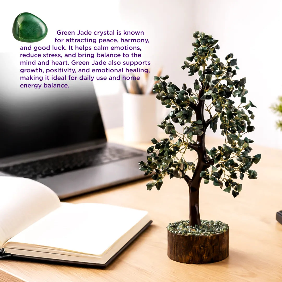 Small green jade tree on a desk with a laptop and open book, text about green jade crystal's benefits.