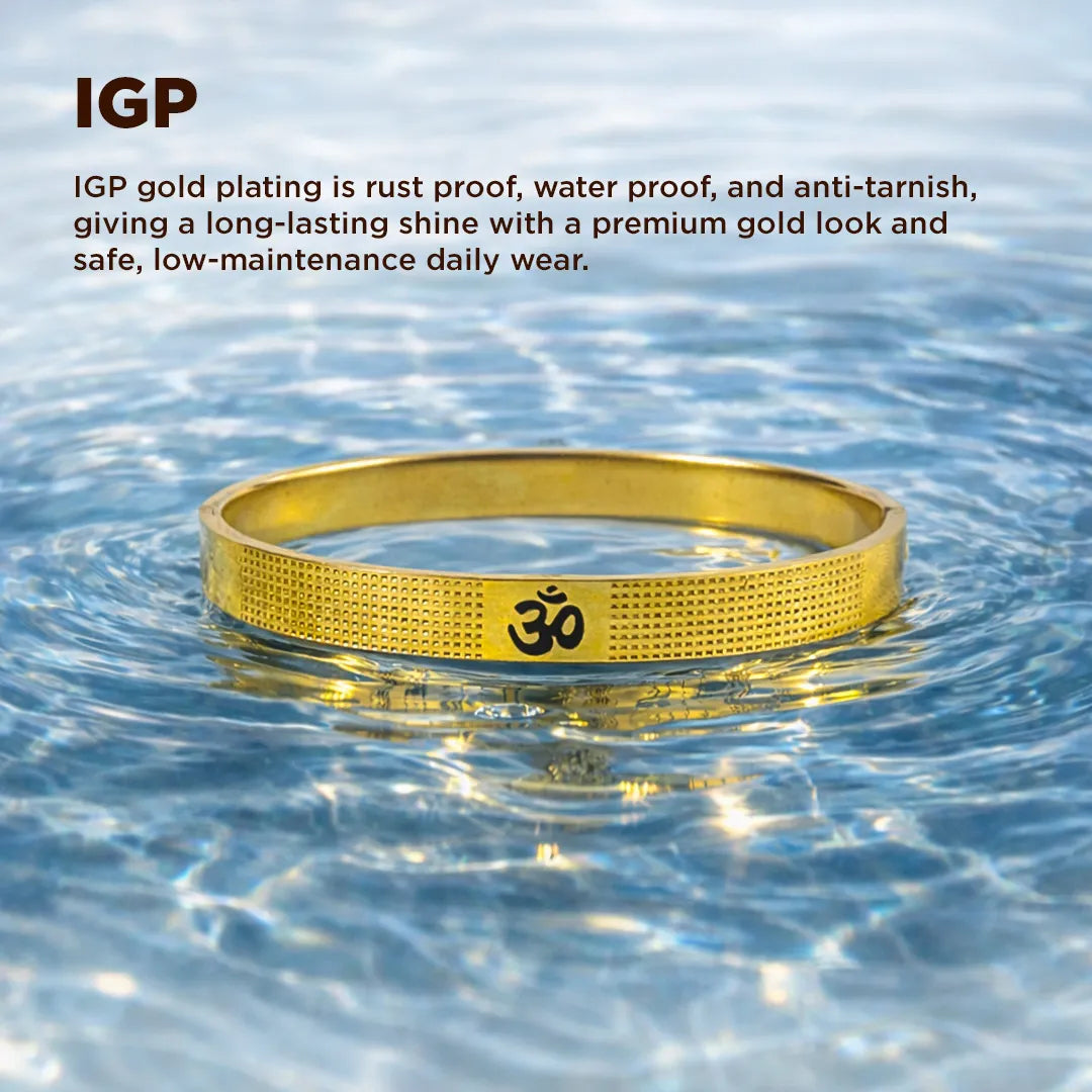 Gold bracelet with Om symbol in water, IGP text about gold plating properties.