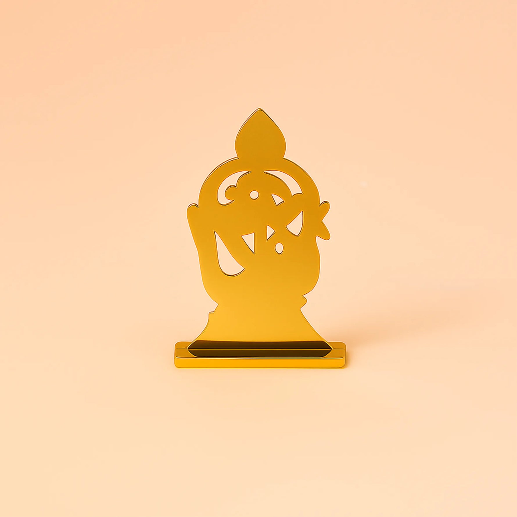 Gold decorative item on a peach backgroundMurugan 1 Peacock Vel – Abhimantrit & Certified