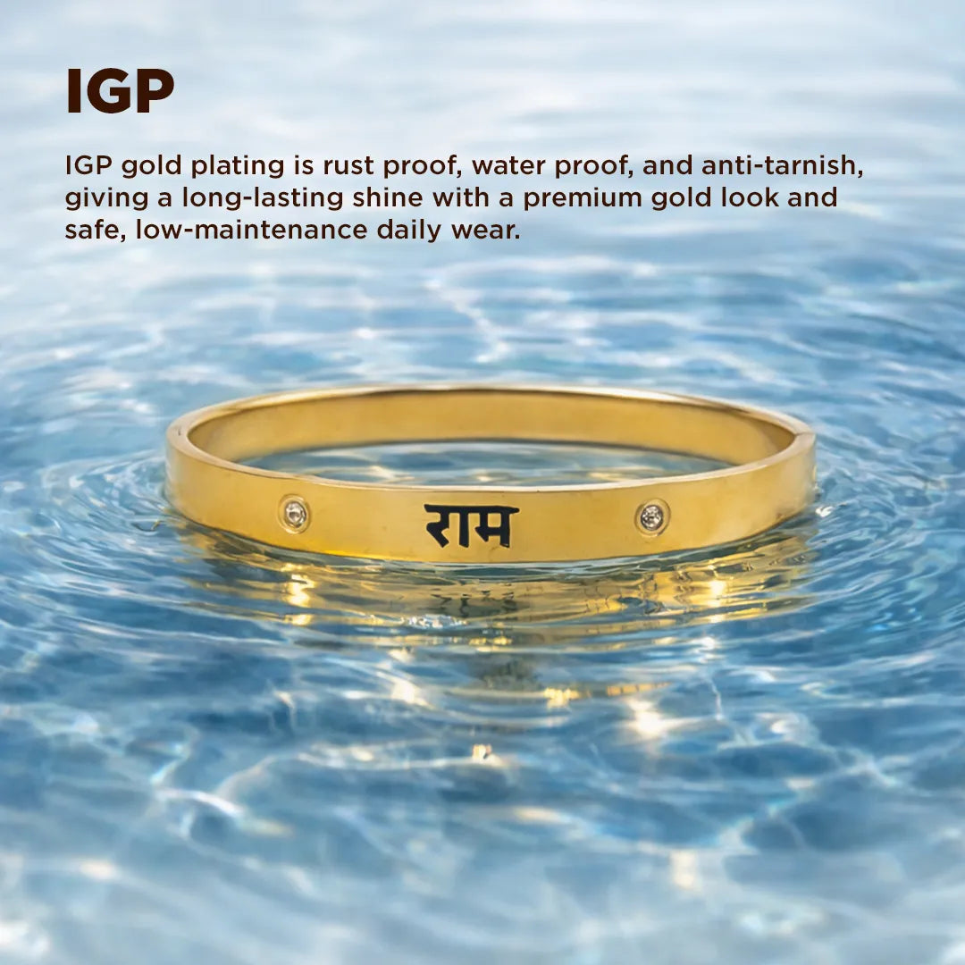 Gold bracelet with engraved text in water, featuring IGP gold plating text.