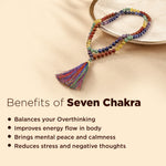 Colorful beaded bracelet with tassel on a beige background, featuring the benefits of Seven Chakra.
