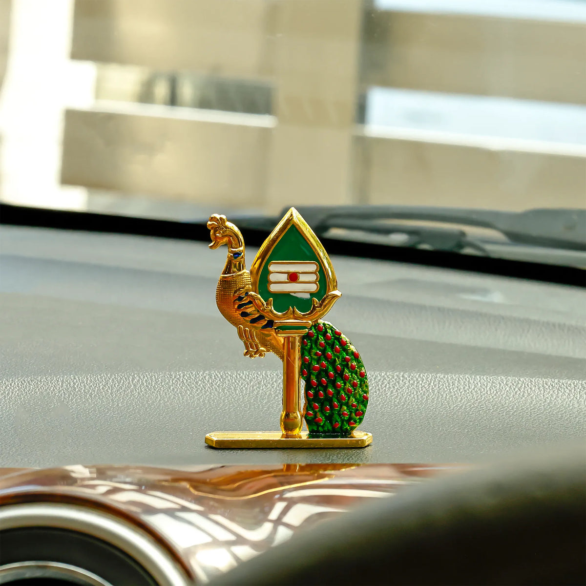 Decorative car emblem on a car's hood with a blurred background