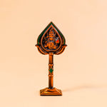 Decorative item with a central figure on a beige background