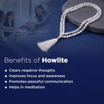 Meditation beads with a blurred office scene in the background, featuring text on howlite benefits.