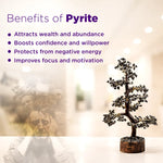 Pyrite stone tree with benefits listed on a blurred background
