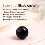 Black agate stone with text on its benefits on a light background