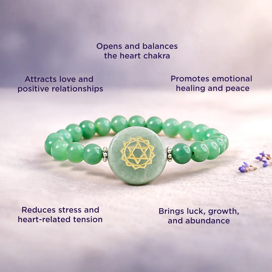 Green beaded bracelet with a gold emblem on a light background