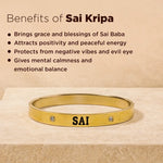 Gold bracelet with 'SAI' engraving on a beige background with text about Sai Kripa benefits.
